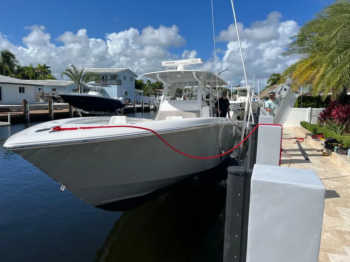 Fly Girl Yacht Photos Pics 2020 Invincible 39 Open Fisherman boat docked in sunny marina setting.