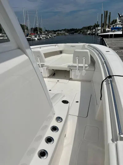 Fly Girl Yacht Photos Pics 2020 Invincible 39 Open Fisherman boat docked at marina, showcasing spacious deck.