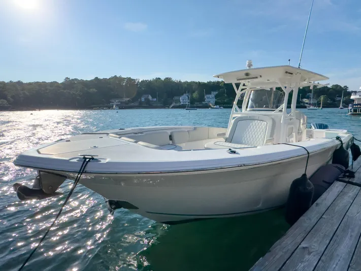 Lil Oa Yacht Photos Pics 2022 Sea Fox 288 Commander boat docked on sunny waterfront.