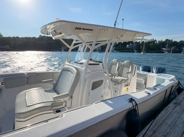 Lil Oa Yacht Photos Pics 2022 Sea Fox 288 Commander boat docked, featuring sleek design and comfortable seating.