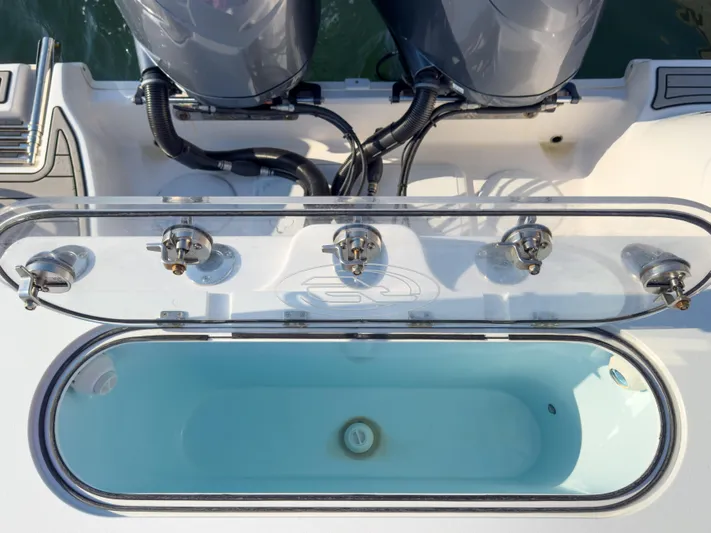 Lil Oa Yacht Photos Pics 2022 Sea Fox 288 Commander boat with open livewell and dual outboard motors.