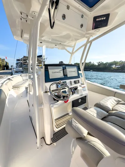 Lil Oa Yacht Photos Pics 2022 Sea Fox 288 Commander boat interior with dual Garmin displays and steering wheel.