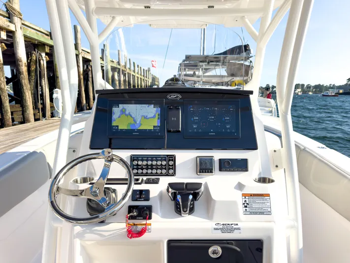 Lil Oa Yacht Photos Pics 2022 Sea Fox 288 Commander helm with advanced navigation displays and controls, dockside view.