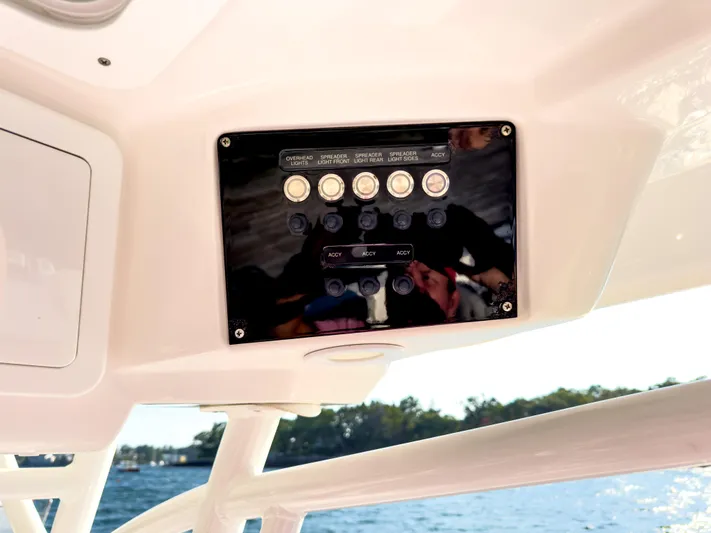 Lil Oa Yacht Photos Pics Control panel on a 2022 Sea Fox 288 Commander boat, overlooking water.