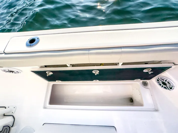 Lil Oa Yacht Photos Pics 2022 Sea Fox 288 Commander boat storage compartment with open hatch, near water.