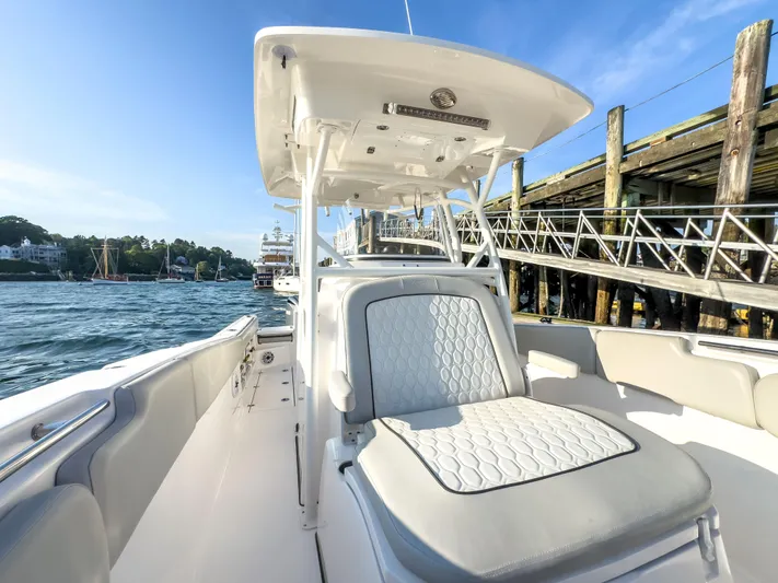 Lil Oa Yacht Photos Pics 2022 Sea Fox 288 Commander boat docked, featuring luxurious seating and sleek design.