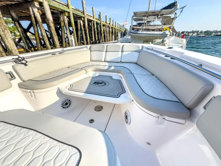 Lil Oa Yacht Photos Pics 2022 Sea Fox 288 Commander boat interior with cushioned seating and elegant design.