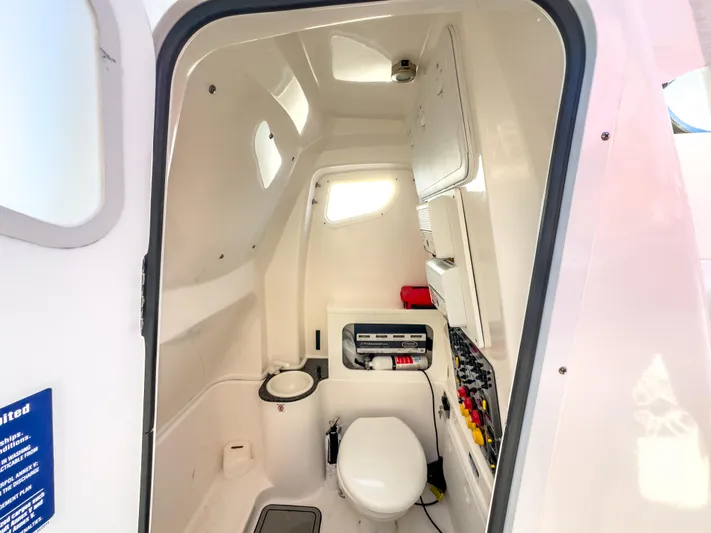Lil Oa Yacht Photos Pics Interior of 2022 Sea Fox 288 Commander boat, featuring a compact marine toilet.