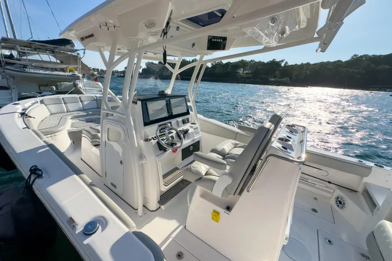Lil Oa Yacht Photos Pics 2022 Sea Fox 288 Commander boat interior with dual Garmin displays, docked on sunny waters.