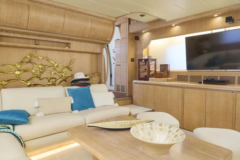  Yacht Photos Pics Luxurious Maiora 20 yacht interior with elegant decor, plush seating, and modern entertainment system.