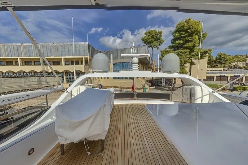  Yacht Photos Pics Deck view of 2002 Maiora 20 yacht docked at marina with clear sky.