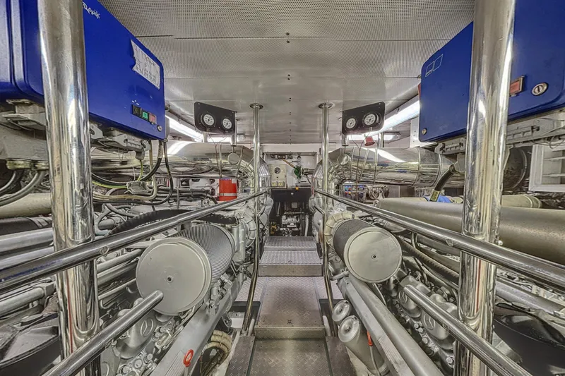  Yacht Photos Pics Engine room of a 2002 Maiora 20 yacht, featuring complex machinery and control panels.