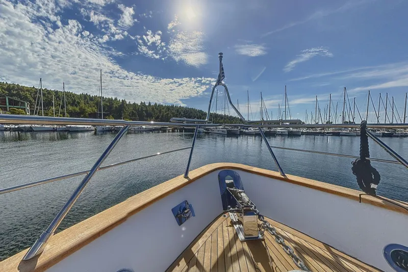  Yacht Photos Pics Bow view of 2002 Maiora 20 yacht in a sunny marina setting.