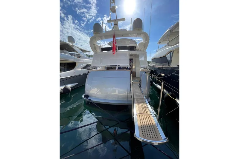  Yacht Photos Pics Luxury Maiora 20 yacht from 2002 docked under a sunny sky.