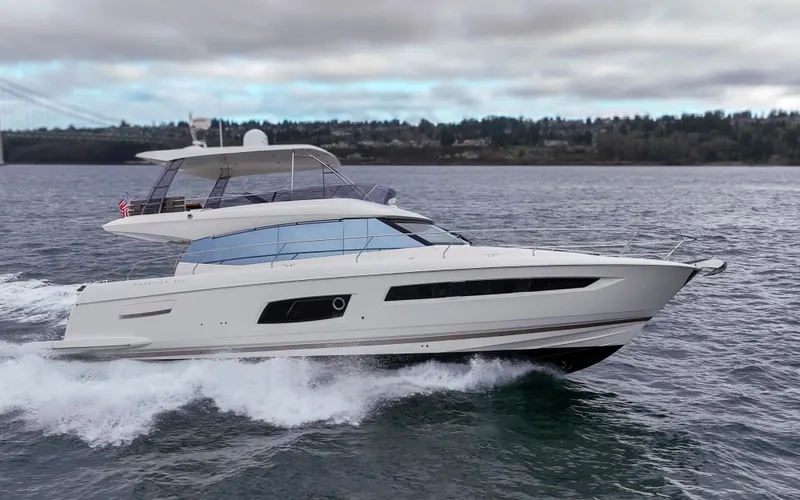 Little Nellie Yacht Photos Pics 2017 Prestige 560 yacht cruising on open water under cloudy skies.