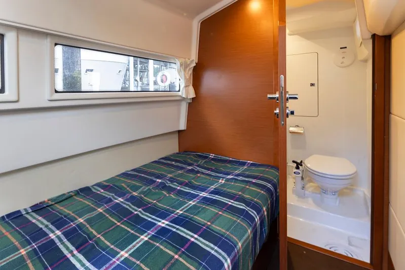 Little Nellie Yacht Photos Pics 2017 Prestige 560 yacht cabin with bed and compact bathroom.