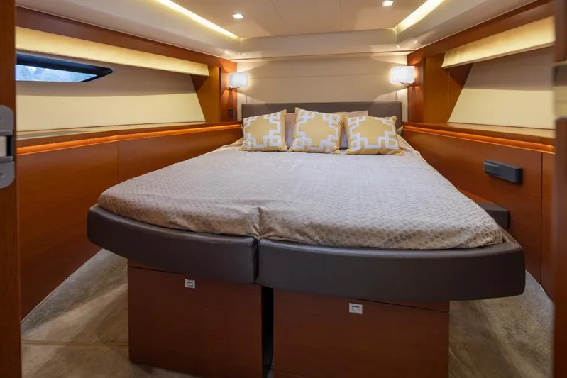 Little Nellie Yacht Photos Pics Luxurious bedroom interior of 2017 Prestige 560 yacht with modern design and cozy bedding.