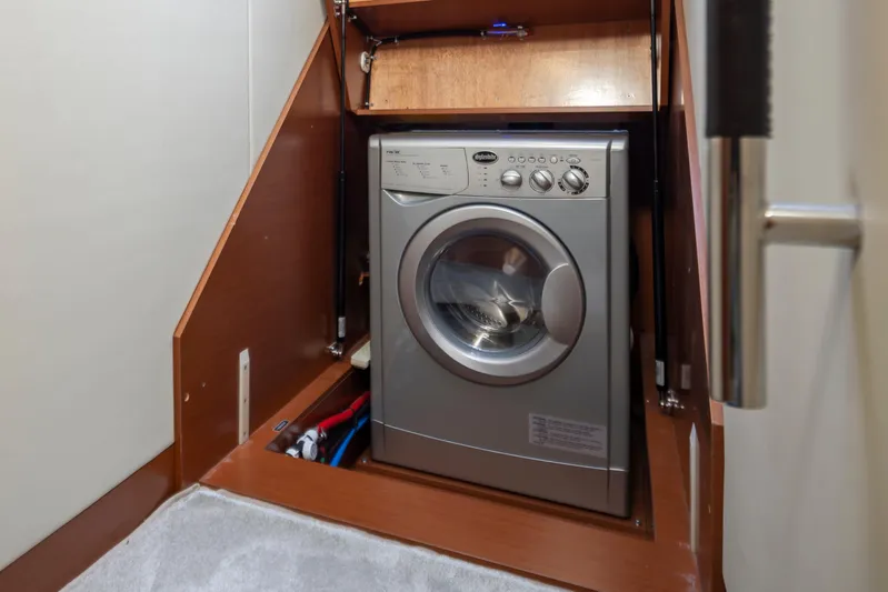 Little Nellie Yacht Photos Pics Compact washing machine in a 2017 Prestige 560 yacht interior.