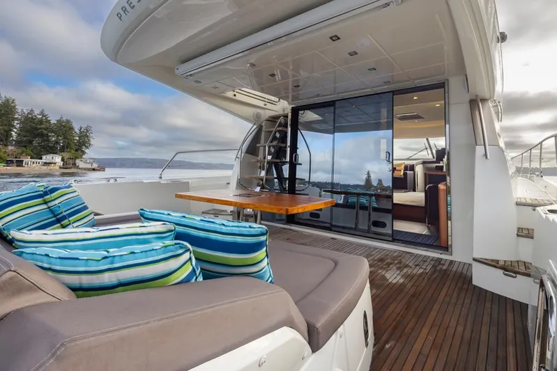 Little Nellie Yacht Photos Pics Luxury 2017 Prestige 560 yacht with outdoor seating and scenic view.