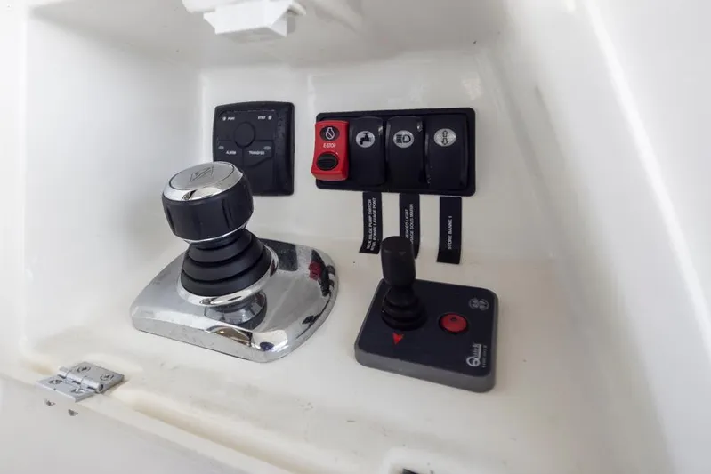 Little Nellie Yacht Photos Pics Control panel of a 2017 Prestige 560 yacht with joystick and switches.