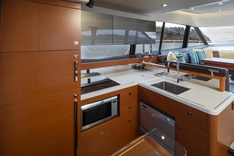 Little Nellie Yacht Photos Pics Luxurious kitchen interior of 2017 Prestige 560 yacht with modern appliances and sleek design.