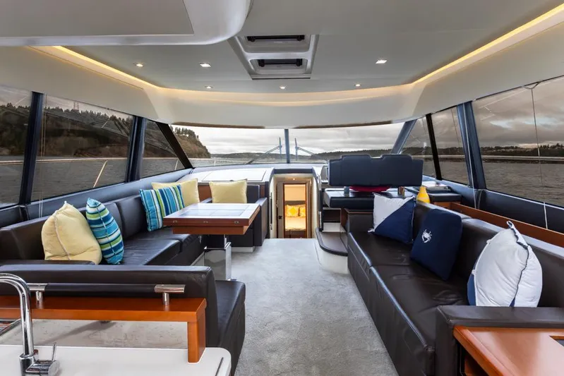 Little Nellie Yacht Photos Pics Luxurious interior of 2017 Prestige 560 yacht with elegant seating and scenic views.