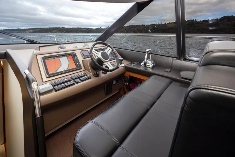 Little Nellie Yacht Photos Pics Luxurious interior of a 2017 Prestige 560 yacht with modern navigation system.