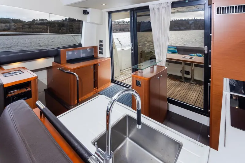 Little Nellie Yacht Photos Pics Interior of 2017 Prestige 560 yacht with modern kitchen and lake view.
