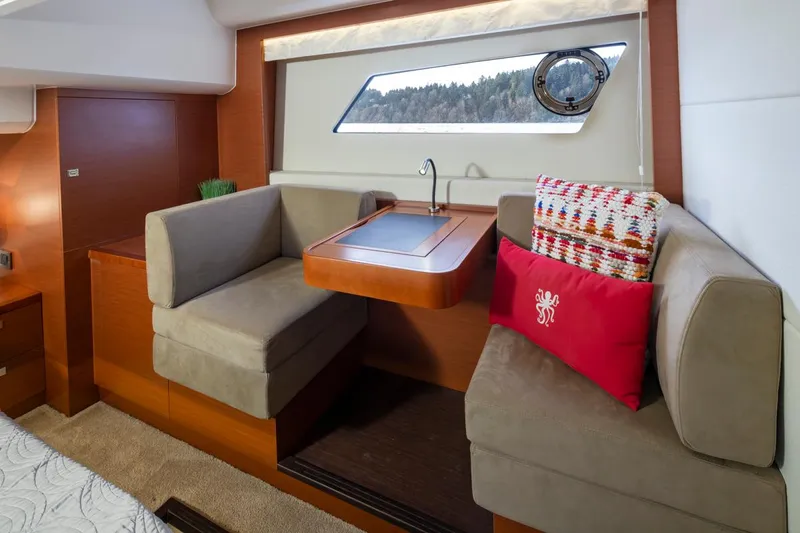 Little Nellie Yacht Photos Pics Luxurious interior of 2017 Prestige 560 yacht with cozy seating and elegant decor.