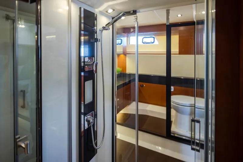 Little Nellie Yacht Photos Pics Luxurious bathroom interior of 2017 Prestige 560 yacht with modern shower and toilet.