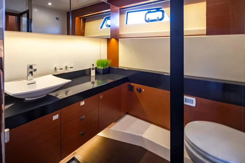 Little Nellie Yacht Photos Pics Luxurious bathroom interior of 2017 Prestige 560 yacht, featuring modern fixtures and elegant design.