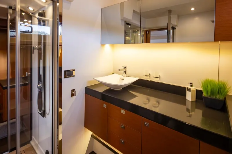 Little Nellie Yacht Photos Pics Luxurious bathroom interior of 2017 Prestige 560 yacht with modern sink and elegant design.