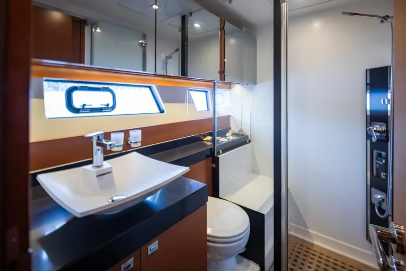 Little Nellie Yacht Photos Pics Luxurious bathroom in 2017 Prestige 560 yacht with modern fixtures and sleek design.