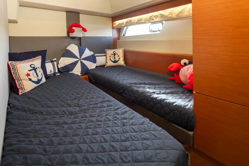 Little Nellie Yacht Photos Pics Twin cabin with nautical decor in 2017 Prestige 560 yacht.