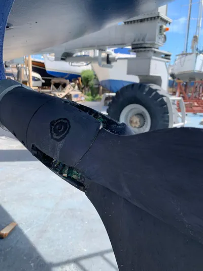  Yacht Photos Pics Close-up of a Hallberg-Rassy 48 MK 2006 sailboat propeller in a shipyard.