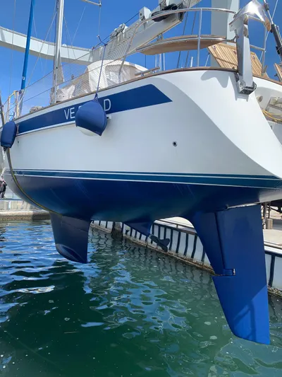  Yacht Photos Pics 2006 Hallberg-Rassy 48 MK sailboat in dry dock, blue and white hull visible.