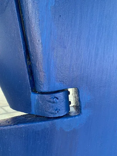  Yacht Photos Pics Close-up of blue rudder hinge on 2006 Hallberg-Rassy 48 MK sailboat.