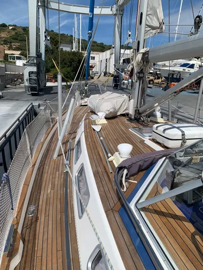  Yacht Photos Pics 2006 Hallberg-Rassy 48 MK sailboat with teak deck and rigging, docked at a marina.