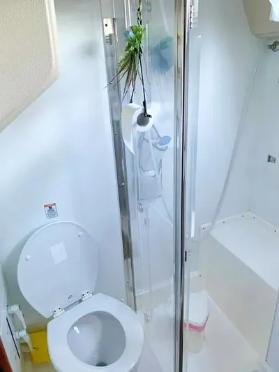  Yacht Photos Pics Bathroom interior of 2006 Hallberg-Rassy 48 MK yacht with toilet and shower.