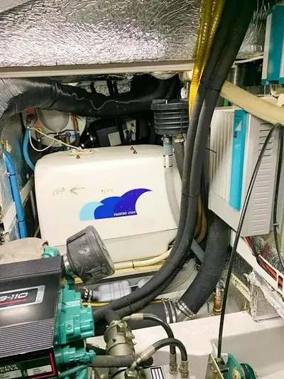  Yacht Photos Pics Engine room of 2006 Hallberg-Rassy 48 MK yacht with visible machinery and components.