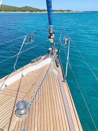  Yacht Photos Pics Deck of 2006 Hallberg-Rassy 48 MK sailboat on clear turquoise water.