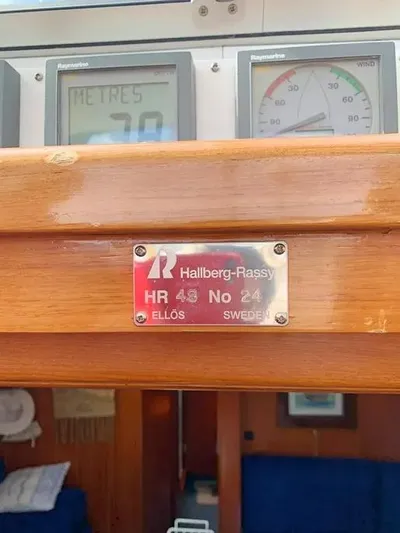  Yacht Photos Pics Hallberg-Rassy 48 MK 2006 yacht interior with control panel and identification plaque.