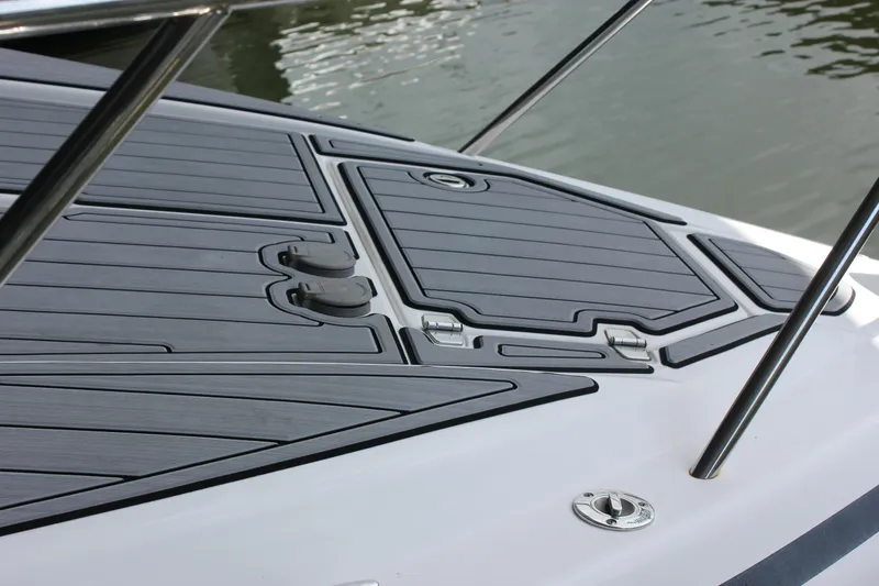  Yacht Photos Pics 2021 Regal 33 XO boat deck with sleek, modern design and water in the background.