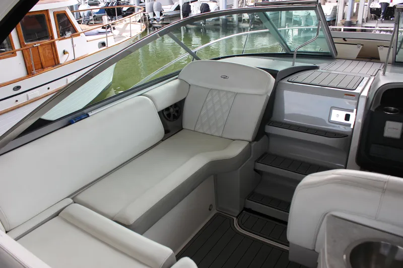  Yacht Photos Pics 2021 Regal 33 XO boat interior with white seating and modern design.