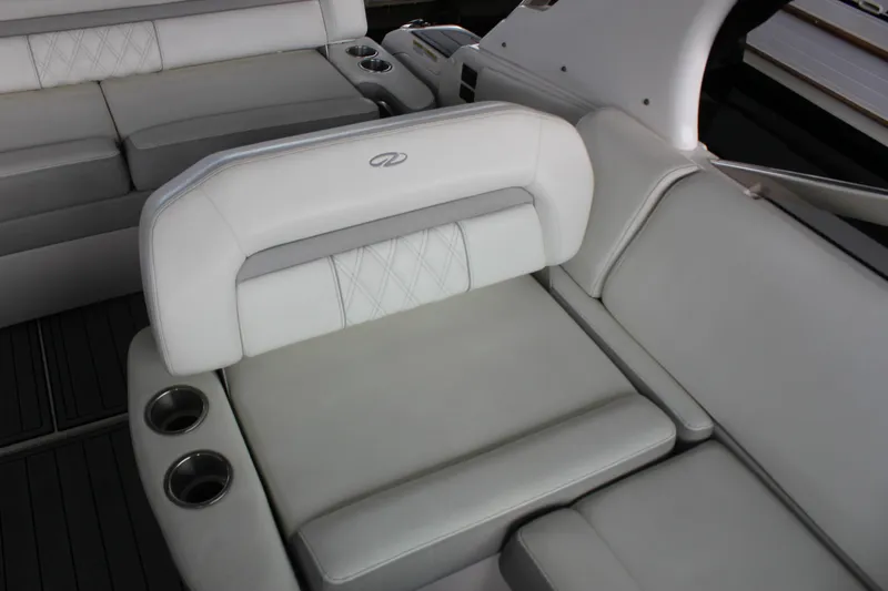  Yacht Photos Pics Luxurious seating on 2021 Regal 33 XO boat with cup holders and elegant design.