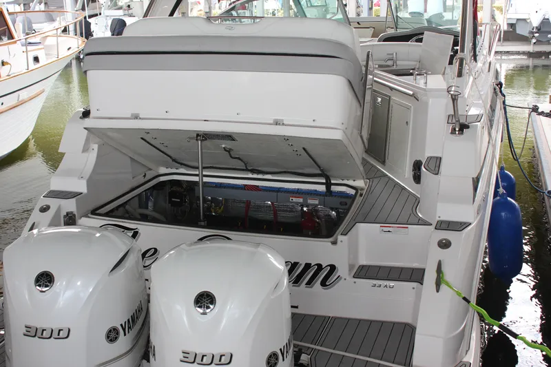  Yacht Photos Pics 2021 Regal 33 XO boat with open engine compartment and twin Yamaha 300 outboard motors.
