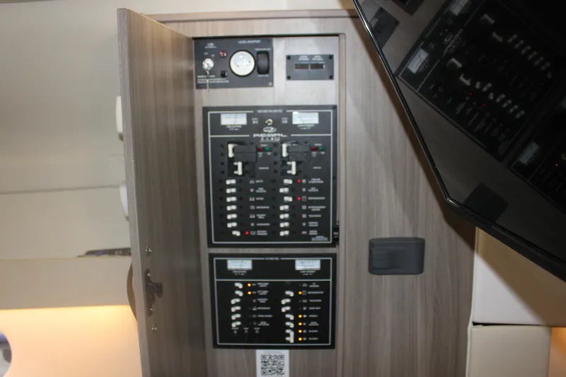  Yacht Photos Pics Electrical panel inside 2021 Regal 33 XO boat, featuring switches and gauges.