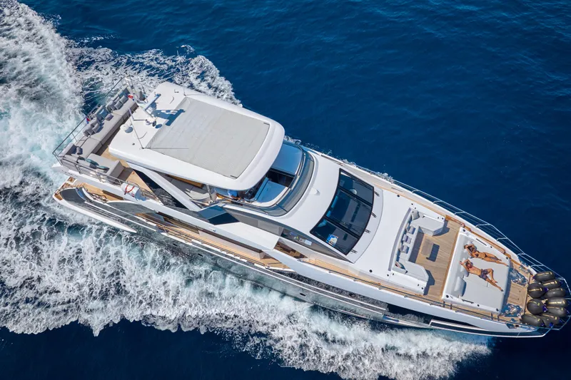 Aluminia Too Yacht Photos Pics 2024 Azimut Grande 27M yacht cruising on open blue sea, aerial view.