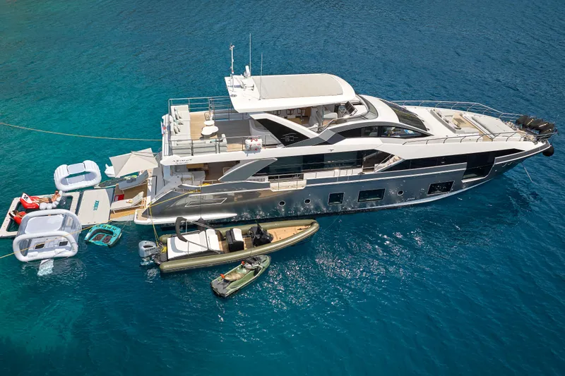 Aluminia Too Yacht Photos Pics 2024 Azimut Grande 27M yacht with inflatables and boats in clear blue water.