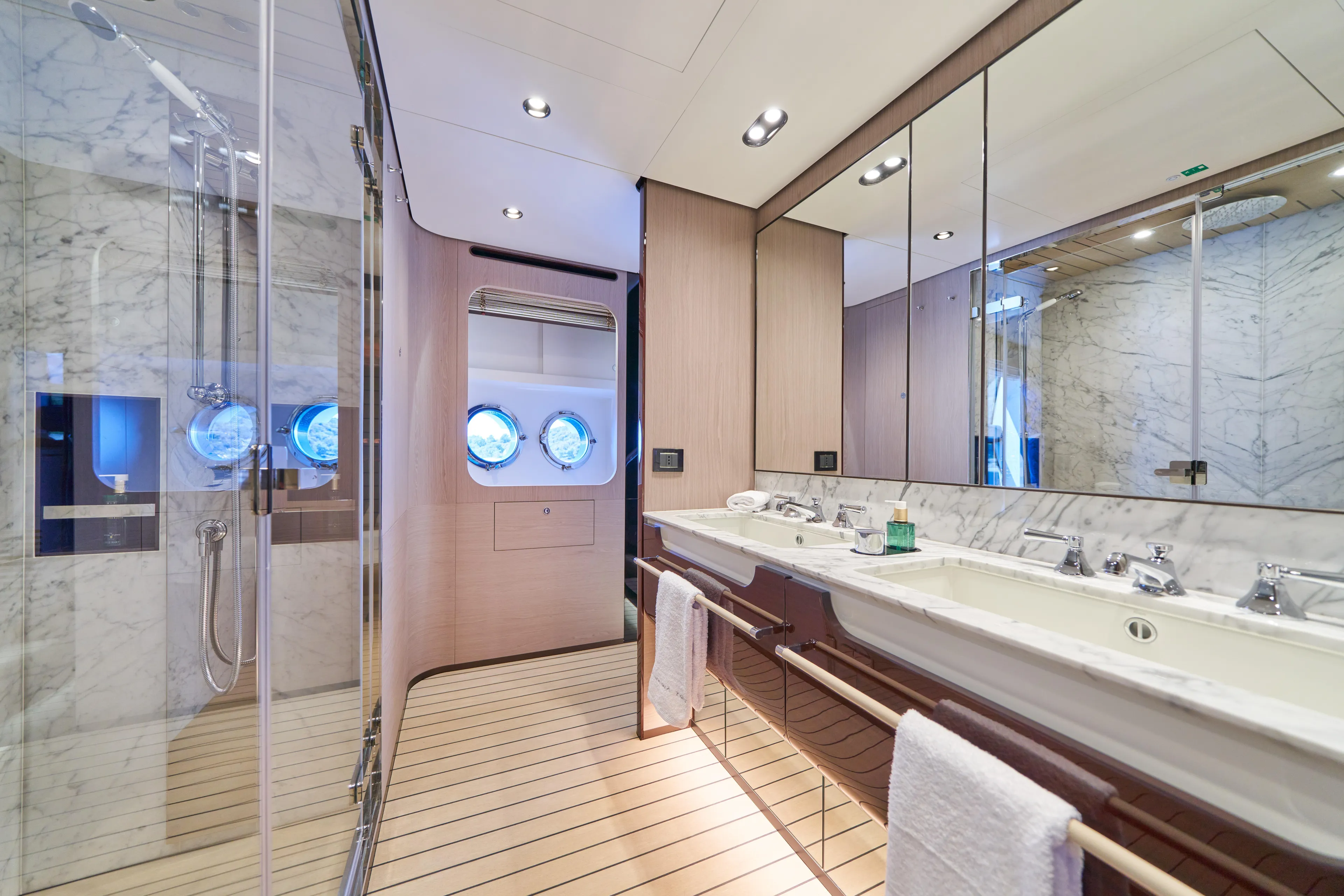 Aluminia Too Yacht Photos Pics Luxurious bathroom in 2024 Azimut Grande 27M yacht with marble and wood finishes.